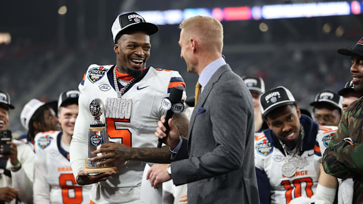 Dec 27, 2024; San Diego, CA, USA;  Syracuse Orange wide receiver Umari Hatcher (5) receives the most valued defensive player against the Washington State Cougars at Snapdragon Stadium. Mandatory Credit: Abe Arredondo-Imagn Images