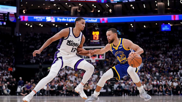 Apr 16, 2024; Sacramento, California, USA; Golden State Warriors guard Stephen Curry (30) dribbles the ball next to Sacramento Kings forward Keegan Murray (13) in the second quarter during a play-in game of the 2024 NBA playoffs at the Golden 1 Center. Mandatory Credit: Cary Edmondson-Imagn Images Apr 16, 2024; Sacramento, California, USA; Golden State Warriors guard Stephen Curry (30) dribbles the ball next to Sacramento Kings forward Keegan Murray (13) in the second quarter during a play-in game of the 2024 NBA playoffs at the Golden 1 Center. Mandatory Credit: Cary Edmondson-Imagn Images