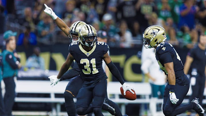 Sep 22, 2024; New Orleans, Louisiana, USA; New Orleans Saints safety Jordan Howden (31) reacts to a turnover against Philadelphia Eagles quarterback Jalen Hurts (1) during the second half at Caesars Superdome. Mandatory Credit: Stephen Lew-Imagn Images Sep 22, 2024; New Orleans, Louisiana, USA; New Orleans Saints safety Jordan Howden (31) reacts to a turnover against Philadelphia Eagles quarterback Jalen Hurts (1) during the second half at Caesars Superdome. Mandatory Credit: Stephen Lew-Imagn Images