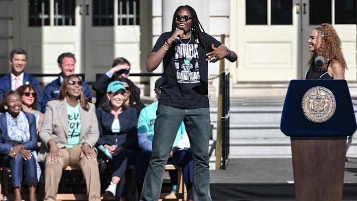 Oct 24, 2024; Manhattan, NY, USA; New York Liberty forward Jonquel Jones speaks during the teams championship celebration at City Hall in New York. Mandatory Credit: John Jones-Imagn Images