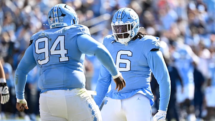 Oct 25, 2025; Chapel Hill, North Carolina, USA; North Carolina Tar Heels defensive lineman Isaiah Johnson (94) celebrtates with defensive tackle D'Antre Robinson (6) after making a sack in the second quarer at Kenan Stadium. Mandatory Credit: Bob Donnan-Imagn Images Oct 25, 2025; Chapel Hill, North Carolina, USA; North Carolina Tar Heels defensive lineman Isaiah Johnson (94) celebrtates with defensive tackle D'Antre Robinson (6) after making a sack in the second quarer at Kenan Stadium. Mandatory Credit: Bob Donnan-Imagn Images