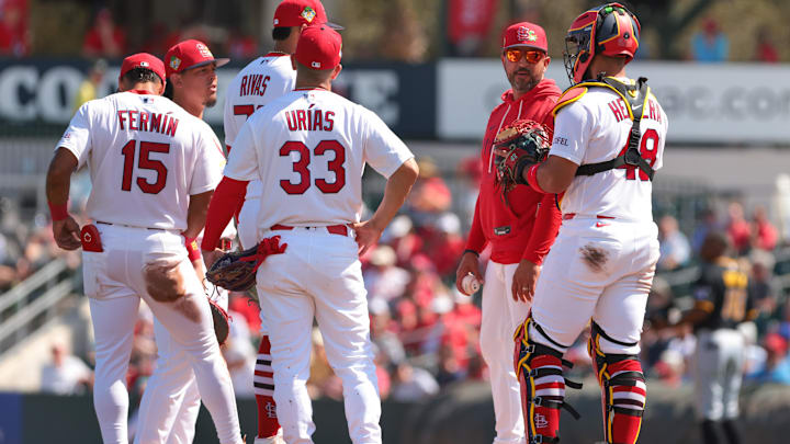 Mar 1, 2026; Jupiter, Florida, USA;  St. Louis Cardinals manager Oliver Marmol (37) speaks to catcher Ivan Herrera (48) during a pitching change against the Pittsburgh Pirates during the third inning at Roger Dean Chevrolet Stadium. Mandatory Credit: Sam Navarro-Imagn Images