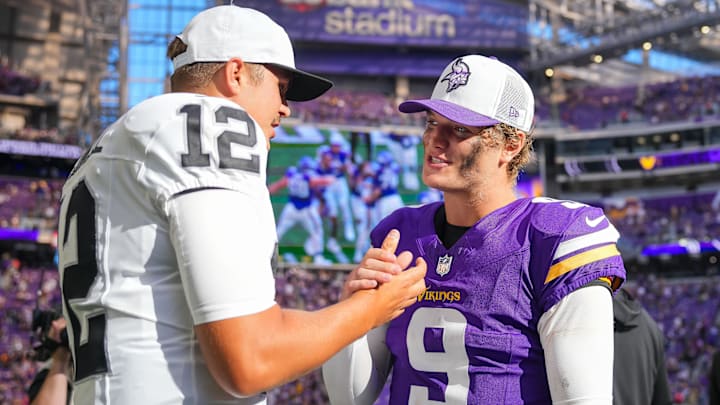 Aug 10, 2024; Minneapolis, Minnesota, USA; Minnesota Vikings quarterback J.J. McCarthy (9) and Las Vegas Raiders quarterback Aidan O'Connell (12) talk after the game at U.S. Bank Stadium. Mandatory Credit: Brad Rempel-Imagn Images
