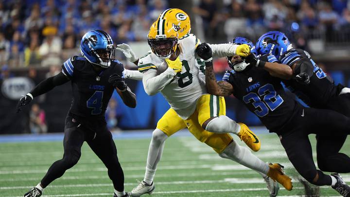 Green Bay Packers running back Josh Jacobs (8) runs the ball for a first down during the fourth quarter against the Detroit Lions at Ford Field. Green Bay Packers running back Josh Jacobs (8) runs the ball for a first down during the fourth quarter against the Detroit Lions at Ford Field.