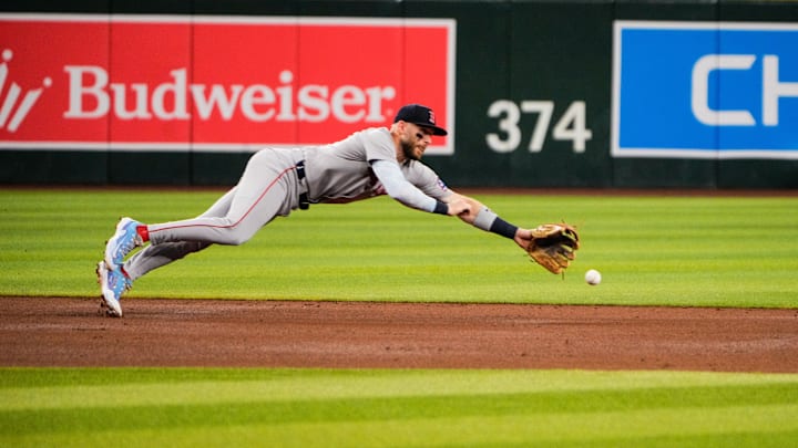 Sep 6, 2025; Phoenix, Arizona, USA;  Boston Red Sox shortstop Trevor Story (10) misses a ball during the second inning against Arizona Diamondbacks at Chase Field. Mandatory Credit: Arianna Grainey-Imagn Images