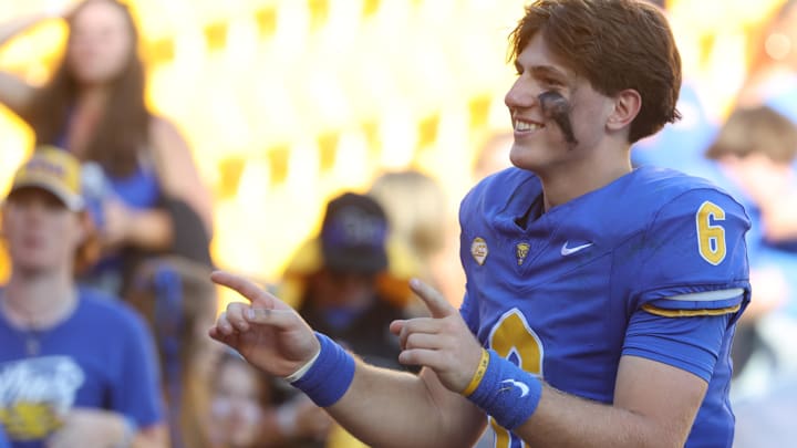 Oct 4, 2025; Pittsburgh, Pennsylvania, USA;  Pittsburgh Panthers quarterback Mason Heintschel (6) leads the Pitt Band in the playing of the alma mater after defeating the Boston College Eagles at Acrisure Stadium. Mandatory Credit: Charles LeClaire-Imagn Images