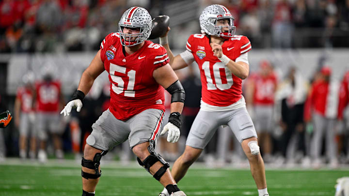 Dec 31, 2025; Arlington, TX, USA; Ohio State Buckeyes offensive lineman Luke Montgomery (51) blocks for Buckeyes quarterback Julian Sayin (10) during the 2025 Cotton Bowl and quarterfinal game of the College Football Playoff at AT&T Stadium. Mandatory Credit: Jerome Miron-Imagn Images