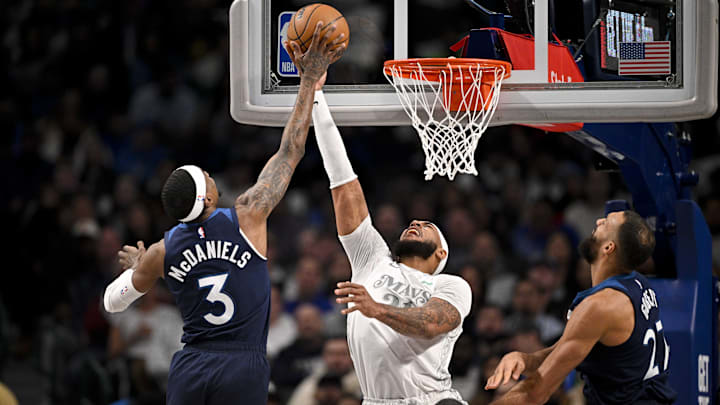 Jan 22, 2025; Dallas, Texas, USA; Minnesota Timberwolves forward Jaden McDaniels (3) and Dallas Mavericks center Daniel Gafford (21) battle for the rebound during the first quarter at the American Airlines Center.