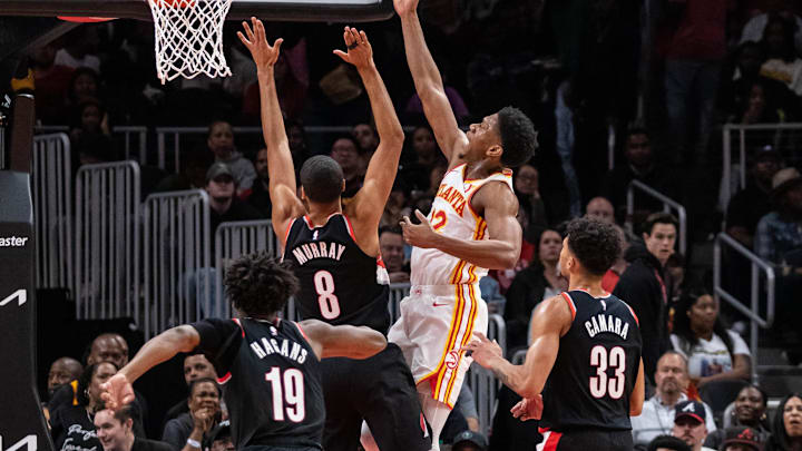 Mar 27, 2024; Atlanta, Georgia, USA; Atlanta Hawks guard Dejounte Murray (5) shoots layup shot