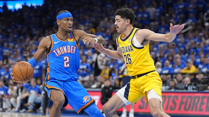 Jun 8, 2025; Oklahoma City, Oklahoma, USA; Oklahoma City Thunder guard Shai Gilgeous-Alexander (2) dribbles the ball against Indiana Pacers guard Ben Sheppard (26) during the second half during game two of the 2025 NBA Finals at Paycom Center. Mandatory Credit: Kyle Terada-Imagn Images