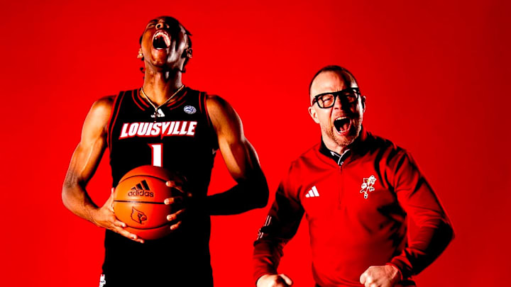 Kennesaw State transfer guard Adrian Wooley and Louisville head coach Pat Kelsey Kennesaw State transfer guard Adrian Wooley and Louisville head coach Pat Kelsey