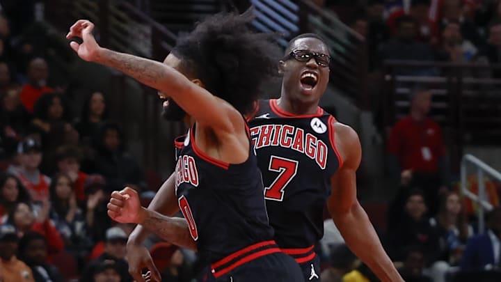 Nov 22, 2024; Chicago, Illinois, USA; Chicago Bulls forward Jalen Smith (7) celebrates with guard Coby White (0) after scoring against the Atlanta Hawks during the second half at United Center. Mandatory Credit: Kamil Krzaczynski-Imagn Images