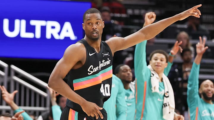 Jan 20, 2026; Houston, Texas, USA; The San Antonio Spurs bench reacts to  forward Harrison Barnes (40) three point basket against the Houston Rockets in the second quarter at Toyota Center. Mandatory Credit: Thomas Shea-Imagn Images