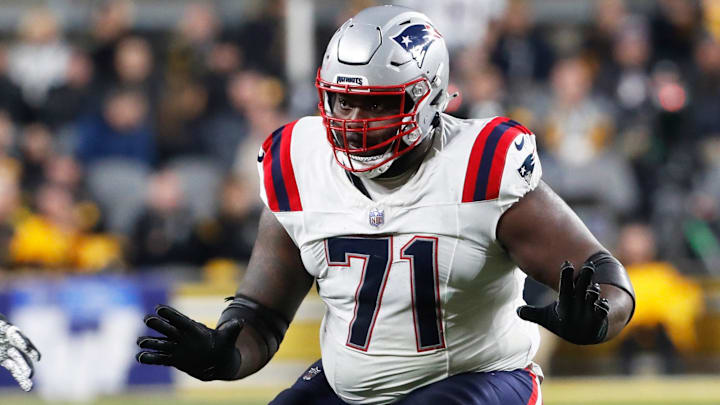 Dec 7, 2023; Pittsburgh, Pennsylvania, USA;  New England Patriots guard Mike Onwenu (71) blocks at the line of scrimmage against the Pittsburgh Steelers during the second quarter at Acrisure Stadium. Mandatory Credit: Charles LeClaire-Imagn Images