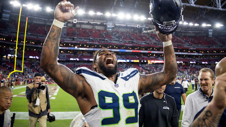 Dec 8, 2024; Glendale, Arizona, USA; Seattle Seahawks defensive end Leonard Williams (99) celebrates after defeating the Arizona Cardinals at State Farm Stadium.