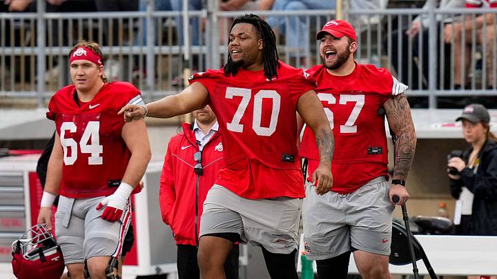 Offensive lineman Phillip Daniels (70) and Austin Siereveld (67) tease their teammate in the first half of the Ohio State football spring game at Ohio Stadium on Saturday, April 18, 2026 in Columbus, Ohio. Offensive lineman Phillip Daniels (70) and Austin Siereveld (67) tease their teammate in the first half of the Ohio State football spring game at Ohio Stadium on Saturday, April 18, 2026 in Columbus, Ohio.