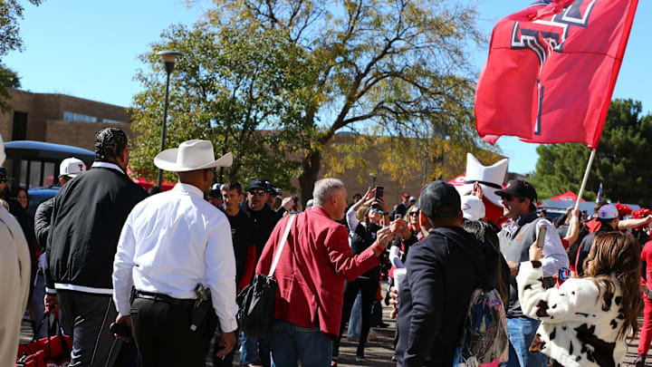 Nov 9, 2024; Lubbock, Texas, USA; Texas Tech Red Raiders head coach Joey McGuire greets fans before the game against the Colorado Buffalos at Jones AT&T Stadium and Cody Campbell Field. Mandatory Credit: Michael C. Johnson-Imagn Images