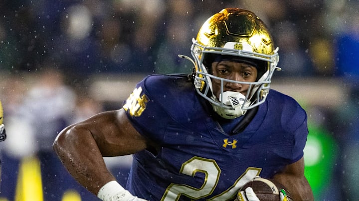 Nov 8, 2025; South Bend, Indiana, USA; Notre Dame Fighting Irish running back Jadarian Price (24) runs the ball against the Navy Midshipmen during the first half at Notre Dame Stadium.