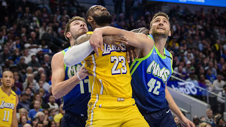 Jan 10, 2020; Dallas, Texas, USA; Dallas Mavericks forward Luka Doncic (77) and forward Maxi Kleber (42) defend against Los Angeles Lakers forward LeBron James (23) during the second half at the American Airlines Center. Mandatory Credit: Jerome Miron-Imagn Images