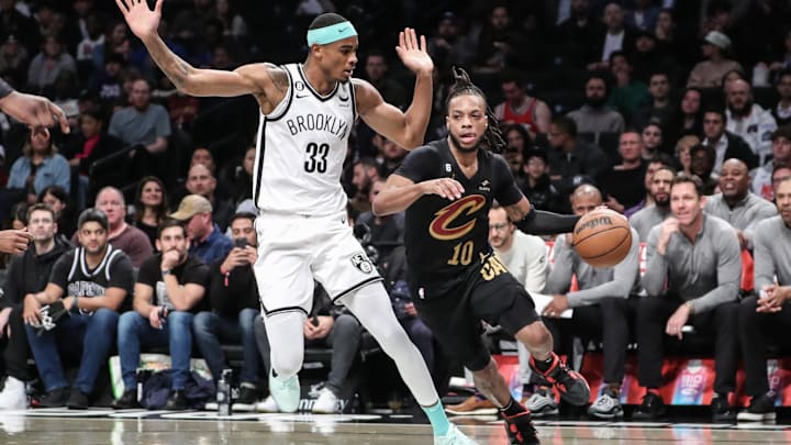 Mar 23, 2023; Brooklyn, New York, USA;  Cleveland Cavaliers guard Darius Garland (10) moves the ball against Brooklyn Nets center Nic Claxton (33) in the first quarter at Barclays Center. Mandatory Credit: Wendell Cruz-Imagn Images
