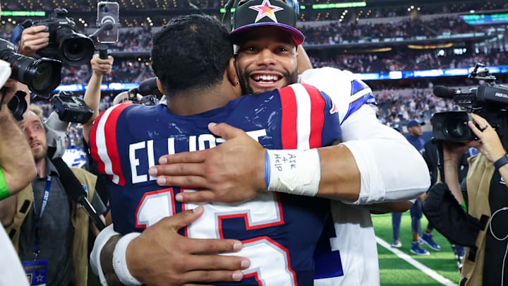 Oct 1, 2023; Arlington, Texas, USA;  Dallas Cowboys quarterback Dak Prescott (4) hugs New England