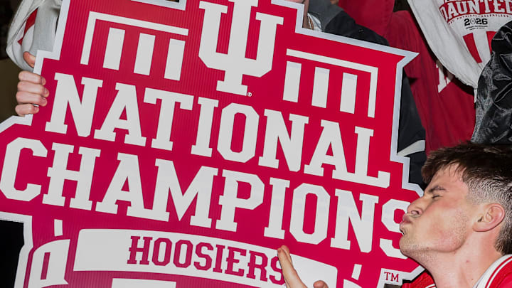 Fans celebrate Monday, Jan. 19, 2026, during a watch party for the College Football Playoff national championship game between the Indiana Hoosiers and the Miami Hurricanes at Simon Skjodt Assembly Hall in Bloomington, Ind.