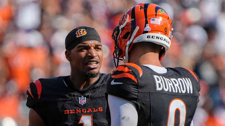 Cincinnati Bengals wide receiver Ja'Marr Chase (1) and quarterback Joe Burrow (9) talk during a timeout in Sunday, October 6, 2024, at Payor Stadium. The Bengals lost to the Baltimore Ravens 41-38 in overtime.