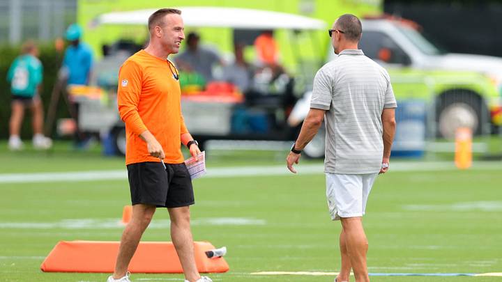 Miami Dolphins head coach Jeff Hafley (left) speaks to general manager Jon-Eric Sullivan (right) during practice at the Baptist Health Training Complex. Miami Dolphins head coach Jeff Hafley (left) speaks to general manager Jon-Eric Sullivan (right) during practice at the Baptist Health Training Complex.
