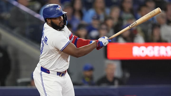 Toronto Blue Jays designated hitter Vladimir Guerrero Jr. (27) hits a two run single against the Minnesota Twins during the sixth inning at Rogers Centre. 
