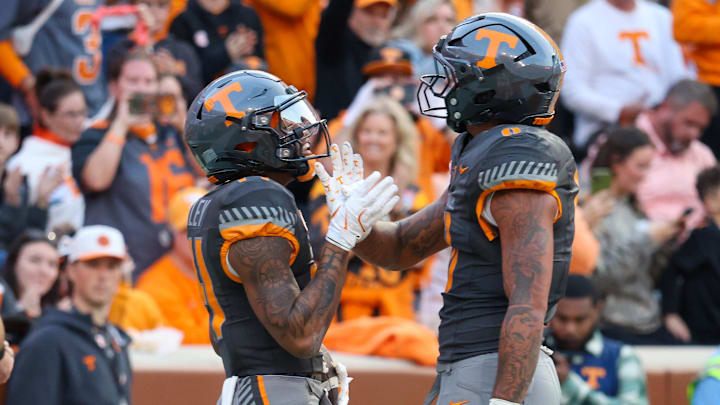 Nov 15, 2025; Knoxville, Tennessee, USA;  Tennessee Volunteers wide receiver Braylon Staley (14) and tight end Ethan Davis (0) celebrate a touchdown against the New Mexico State Aggies during the first half at Neyland Stadium. Mandatory Credit: Randy Sartin-Imagn Images