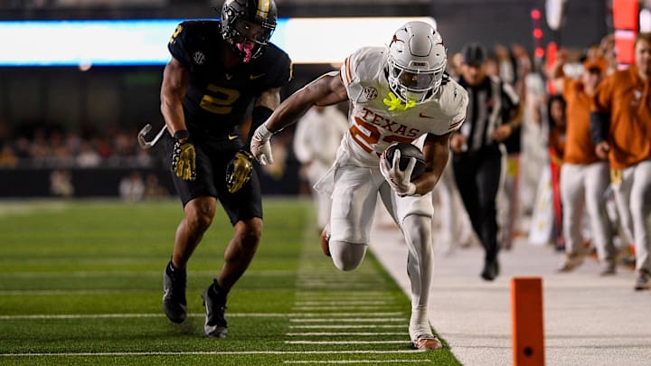 Oct 26, 2024; Nashville, Tennessee, USA; Vanderbilt Commodores linebacker Randon Fontenette (2) shoves Texas Longhorns running back Jaydon Blue (23) out of bounds during the second half at FirstBank Stadium. Mandatory Credit: Steve Roberts-Imagn Images Oct 26, 2024; Nashville, Tennessee, USA; Vanderbilt Commodores linebacker Randon Fontenette (2) shoves Texas Longhorns running back Jaydon Blue (23) out of bounds during the second half at FirstBank Stadium. Mandatory Credit: Steve Roberts-Imagn Images