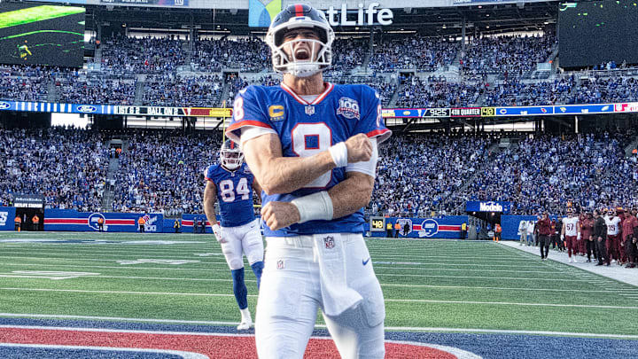 Nov 3, 2024; East Rutherford, New Jersey, USA; New York Giants quarterback Daniel Jones (8) celebrates after scoring a 2nd half touchdown against the Washington Commanders at MetLife Stadium. Mandatory Credit: Robert Deutsch-Imagn Images