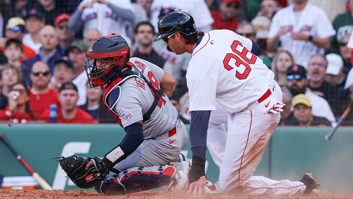 Boston Red Sox first baseman Triston Casas scores past St. Louis Cardinals catcher Ivan Herrera.
