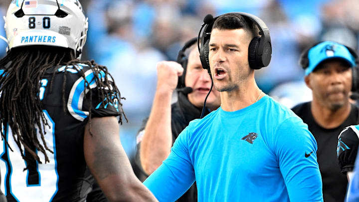 Nov 3, 2024; Charlotte, North Carolina, USA; Carolina Panthers head coach Dave Canales with Ian Thomas (80) in the third qarter at Bank of America Stadium. Mandatory Credit: Bob Donnan-Imagn Images