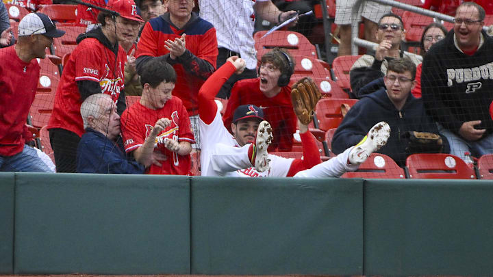 May 25, 2025; St. Louis, Missouri, USA; St. Louis Cardinals third baseman Nolan Arenado (28) falls in to the crowd after catching a foul ball hit by Arizona Diamondbacks second baseman Ketel Marte (not pictured) during the ninth inning at Busch Stadium. Mandatory Credit: Jeff Curry-Imagn Images May 25, 2025; St. Louis, Missouri, USA; St. Louis Cardinals third baseman Nolan Arenado (28) falls in to the crowd after catching a foul ball hit by Arizona Diamondbacks second baseman Ketel Marte (not pictured) during the ninth inning at Busch Stadium. Mandatory Credit: Jeff Curry-Imagn Images