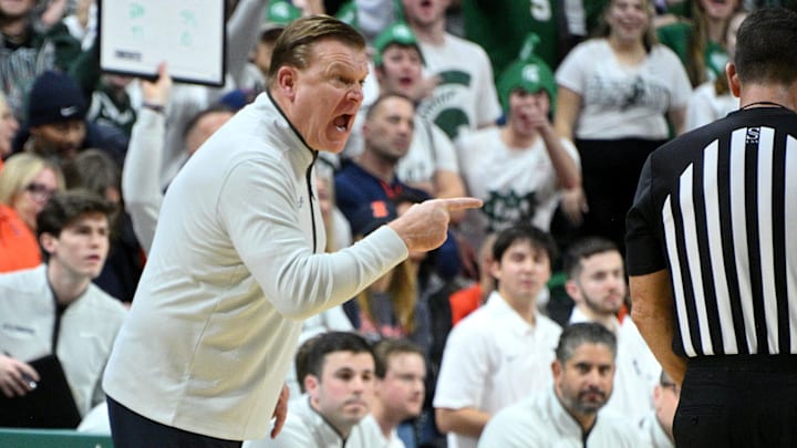 Jan 19, 2025; East Lansing, Michigan, USA;  Illinois Fighting Illini head coach Brad Underwood reacts during the first half against the Michigan State Spartans at Jack Breslin Student Events Center. Mandatory Credit: Dale Young-Imagn Images