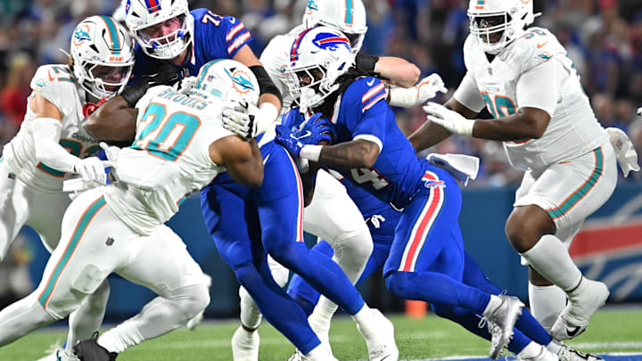 Sep 18, 2025; Orchard Park, New York, USA; Buffalo Bills running back James Cook (4) runs against the Miami Dolphins in the first quarte at Highmark Stadium. Mandatory Credit: Mark Konezny-Imagn Images