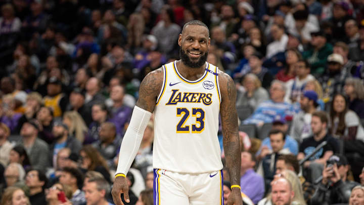 Dec 21, 2024; Sacramento, California, USA; Los Angeles Lakers forward LeBron James (23) smiles after his team scored against the Sacramento Kings during the fourth quarter at Golden 1 Center. Mandatory Credit: Ed Szczepanski-Imagn Images