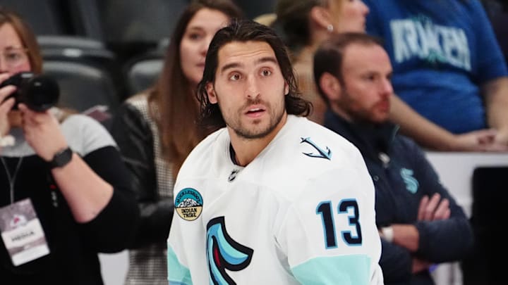 Nov 5, 2024; Denver, Colorado, USA; Seattle Kraken left wing Brandon Tanev (13) before the game against the Colorado Avalanche at Ball Arena. Mandatory Credit: Ron Chenoy-Imagn Images