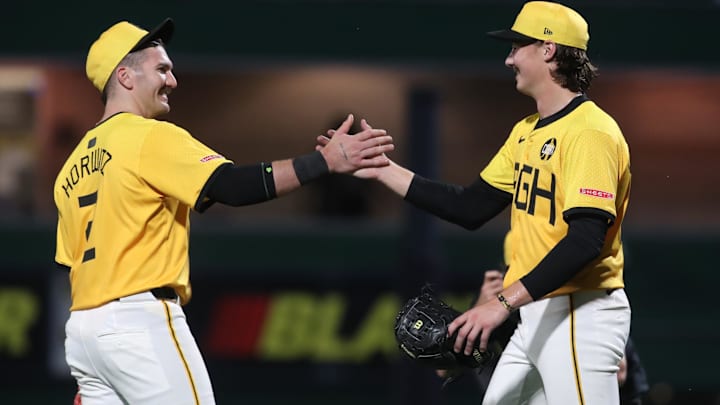 Aug 22, 2025; Pittsburgh, Pennsylvania, USA; Pittsburgh Pirates first baseman Spencer Horwitz (2) and relief pitcher Bubba Chandler (57) celebrates with after the game against the Colorado Rockies at PNC Park. Mandatory Credit: Charles LeClaire-Imagn Images