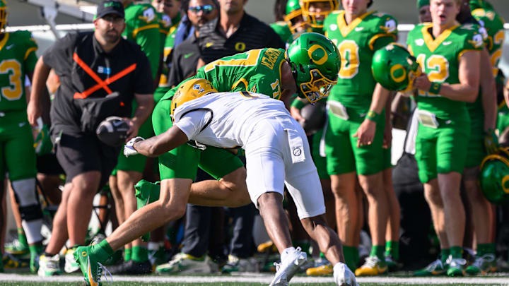 Aug 31, 2024; Eugene, Oregon, USA; Idaho Vandals defensive back Andrew Marshall (7) tackles Oregon Ducks wide receiver Kyler Kasper (17) during the first half at Autzen Stadium. Mandatory Credit: Craig Strobeck-Imagn Images