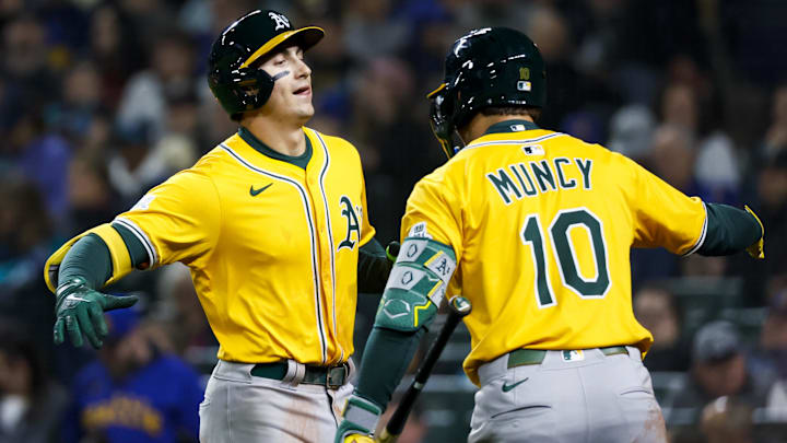Mar 27, 2025; Seattle, Washington, USA; Athletics first baseman Tyler Soderstrom (21) celebrates with second baseman Max Muncy (10) after hitting a solo-home run against the Seattle Mariners during the fifth inning at T-Mobile Park. Mandatory Credit: Joe Nicholson-Imagn Images Mar 27, 2025; Seattle, Washington, USA; Athletics first baseman Tyler Soderstrom (21) celebrates with second baseman Max Muncy (10) after hitting a solo-home run against the Seattle Mariners during the fifth inning at T-Mobile Park. Mandatory Credit: Joe Nicholson-Imagn Images