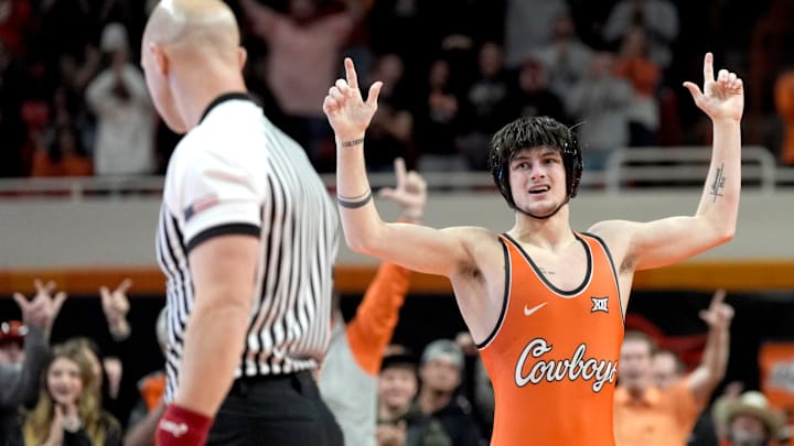 Oklahoma State's Jax Forrest celebrates after winning his match over Oklahoma's Carter Schmidt at 133 pounds during a Bedlam wrestling dual between the Oklahoma State Cowboys (OSU) and the University of Oklahoma Sooners (OU) at Gallagher-Iba in Stillwater, Okla., Sunday, Jan. 11, 2026.