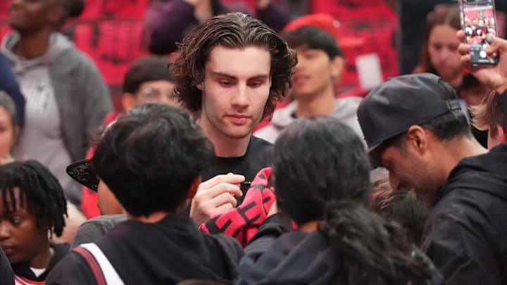 Apr 16, 2025; Chicago, Illinois, USA; Chicago Bulls guard Josh Giddey (3) signs autographs before the game against the Miami Heat at United Center. Mandatory Credit: David Banks-Imagn Images