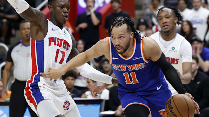 Apr 24, 2025; Detroit, Michigan, USA; New York Knicks guard Jalen Brunson (11) dribbles defended by Detroit Pistons guard Dennis Schroder (17) in the first half during game three of first round for the 2024 NBA Playoffs at Little Caesars Arena. Mandatory Credit: Rick Osentoski-Imagn Images