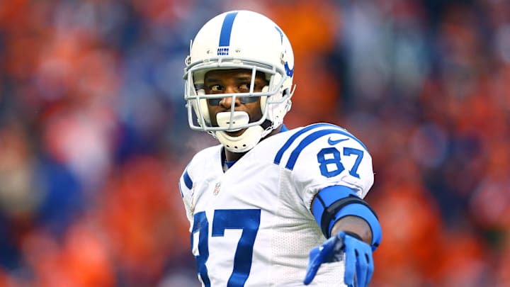 Indianapolis Colts wide receiver Reggie Wayne (87) reacts against the Denver Broncos in the 2014 AFC Divisional playoff football game at Sports Authority Field at Mile High.
