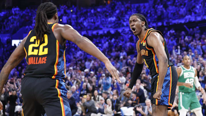 Jan 5, 2025; Oklahoma City, Oklahoma, USA; Oklahoma City Thunder guard Cason Wallace (22) and Oklahoma City Thunder forward Jalen Williams (8) celebrate after Cason scores against the Boston Celtics during the fourth quarter at Paycom Center. Mandatory Credit: Alonzo Adams-Imagn Images