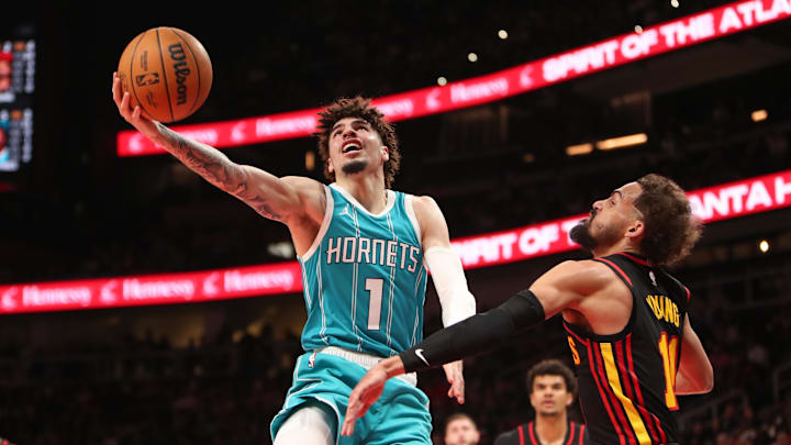 Mar 12, 2025; Atlanta, Georgia, USA; Charlotte Hornets guard LaMelo Ball (1) shoots against Atlanta Hawks guard Trae Young (11) during the second half at State Farm Arena. Mandatory Credit: Mady Mertens-Imagn Images