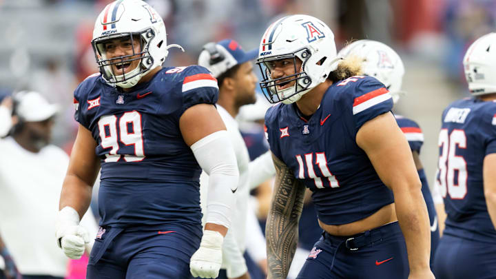 Nov 22, 2025; Tucson, Arizona, USA; Arizona Wildcats defensive lineman Mays Pese (99) and Julian Savaiinaea (41) against the Baylor Bears at Casino Del Sol Stadium. Mandatory Credit: Mark J. Rebilas-Imagn Images