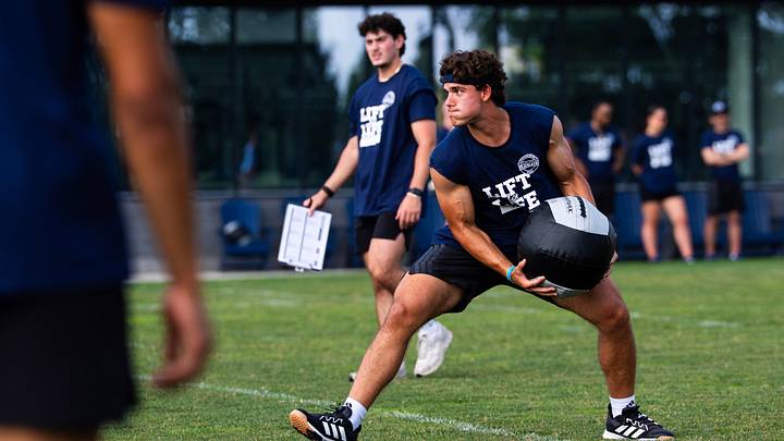 Penn State Nittany Lions quarterback Rocco Becht tosses a medicine ball during a relay race at the 23rd annual Lift for Life at Holuba Hall. Penn State Nittany Lions quarterback Rocco Becht tosses a medicine ball during a relay race at the 23rd annual Lift for Life at Holuba Hall.